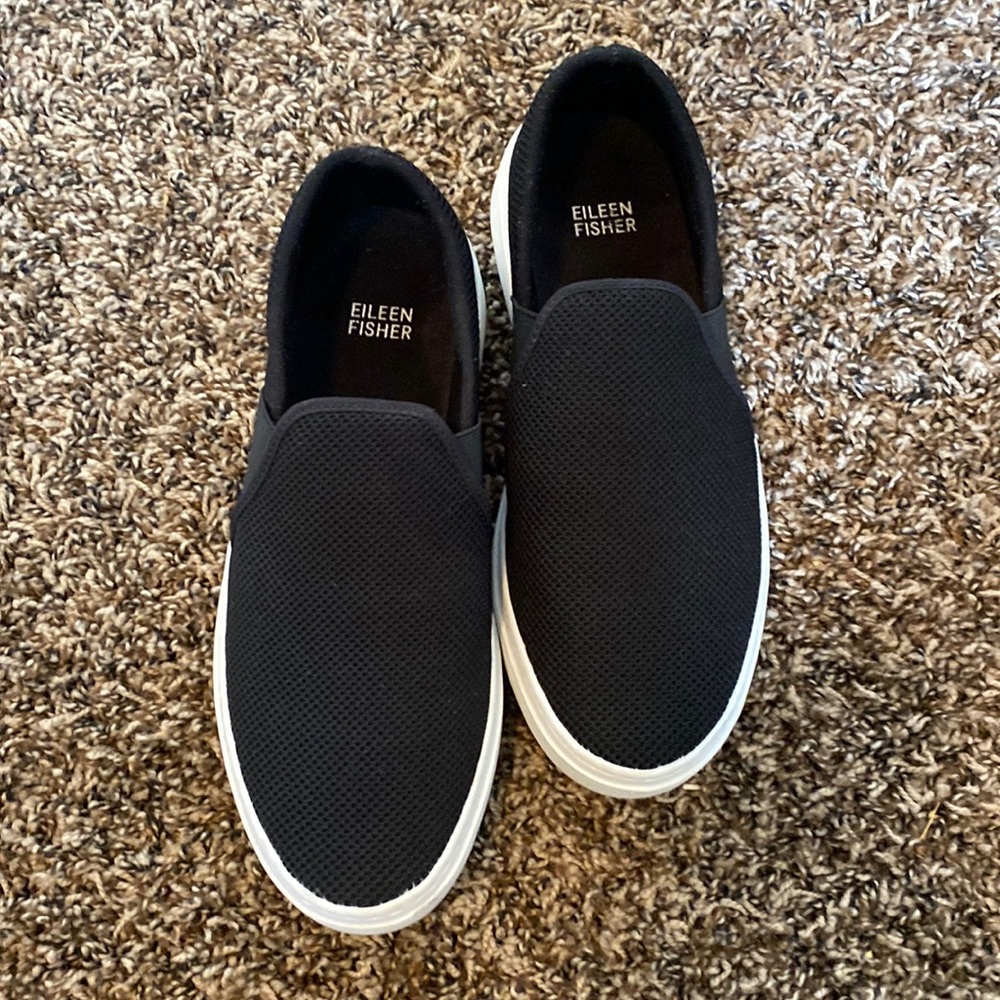 Eileen Fisher black slip on shoes.